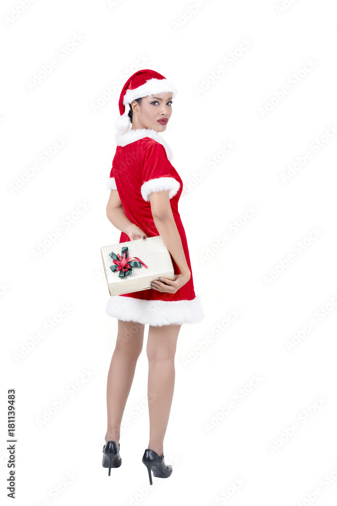 Christmas concept : Beautiful middle-aged Asian woman in Santa Claus costume holding Christmas gift isolated on white background Christmas concept : Beautiful middle-aged Asian woman in Santa Claus costume holding Christmas gift isolated on white background