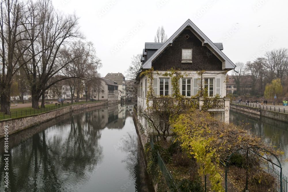 Strasbourg, France - old european town cityscape - canals, embanlment, houses. December.