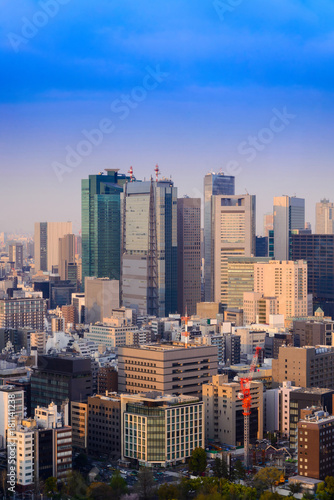 Aerial skyscraper view of office building and downtown and cityscape of Tokyo city with blue sly and cloud background. tokyo, Japan, Asia © lukyeee_nuttawut