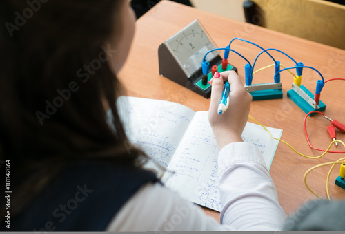Schoolgirl at a physics lesson