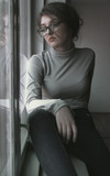 Portrait of a beautiful woman. Woman in glasses.