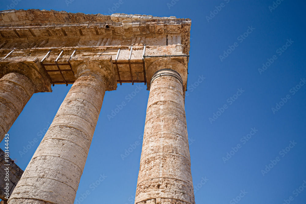 Some tourists visiting ancient Greek temple at Segesta in Sicily, Italy. Some tourists visiting ancient Greek temple at Segesta in Sicily, Italy.