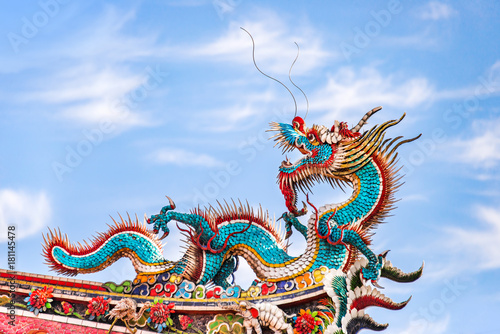 Wallpaper Mural Beautiful dragon crawling on the decorative tile roof in Chinese temples. Colorful roof detail of traditional Chinese temple Torontodigital.ca