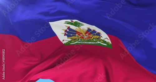 Haitian flag waving at wind with blue sky, loop photo