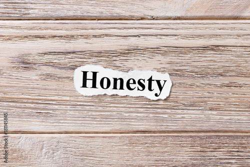 Honesty of the word on paper. concept. Words of Honesty on a wooden background