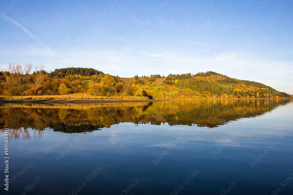 Hill reflection in water