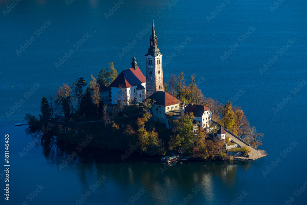 Bled, Slovenia - Aerial sunrise view of Lake Bled with the famous Pilgrimage Church of the Assumption of Maria taken from Ostrica viewpoint at autumn