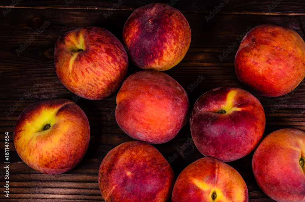 Fresh ripe peaches on wooden table. Top view
