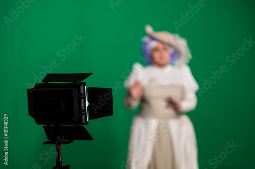 The actress shot on green background. Lighting equipment in the Studio. photo