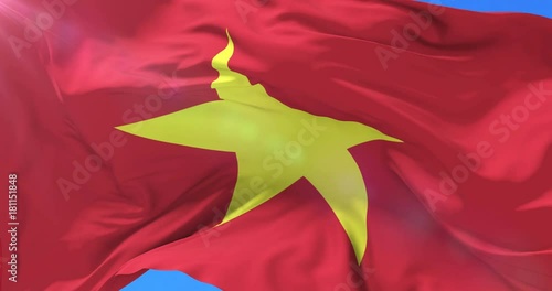 Vietnamese flag waving at wind with blue sky, loop photo