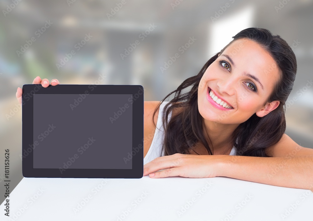 Woman holding tablet with office background Woman holding tablet with office background