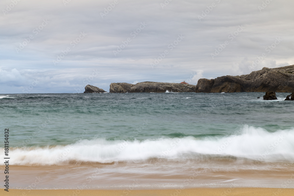 beautiful beach with waves breaking on the shore and without people
beautiful beach with waves breaking on the shore and without people