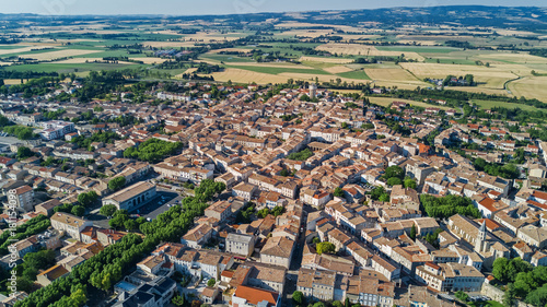 Aerial top view of residential area houses roofs and streets from above, old medieval town background, France 