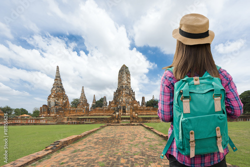 Traveler women with backpack walking in temple Ayuttaya, Thailand, Select focus