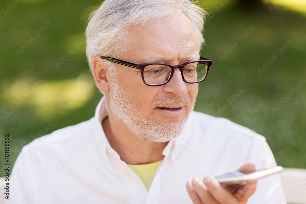 old man using voice command recorder on smartphone old man using voice command recorder on smartphone