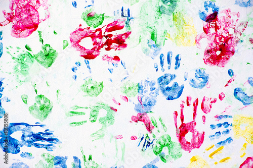colorful child hand prints on white background