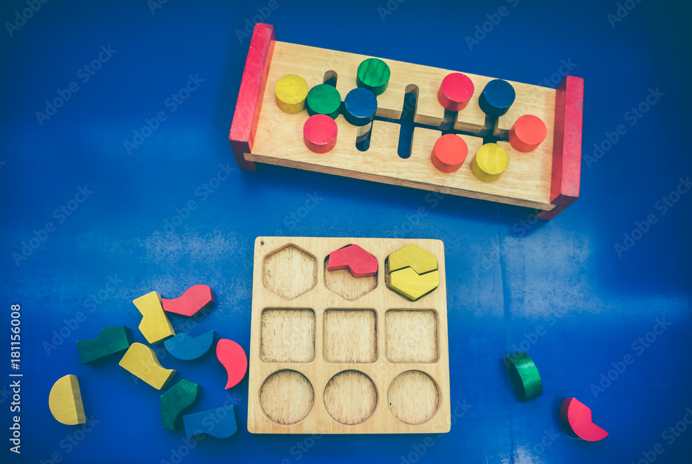 Top view of toy wooden blocks on blue background. Top view of toy wooden blocks on blue background.
