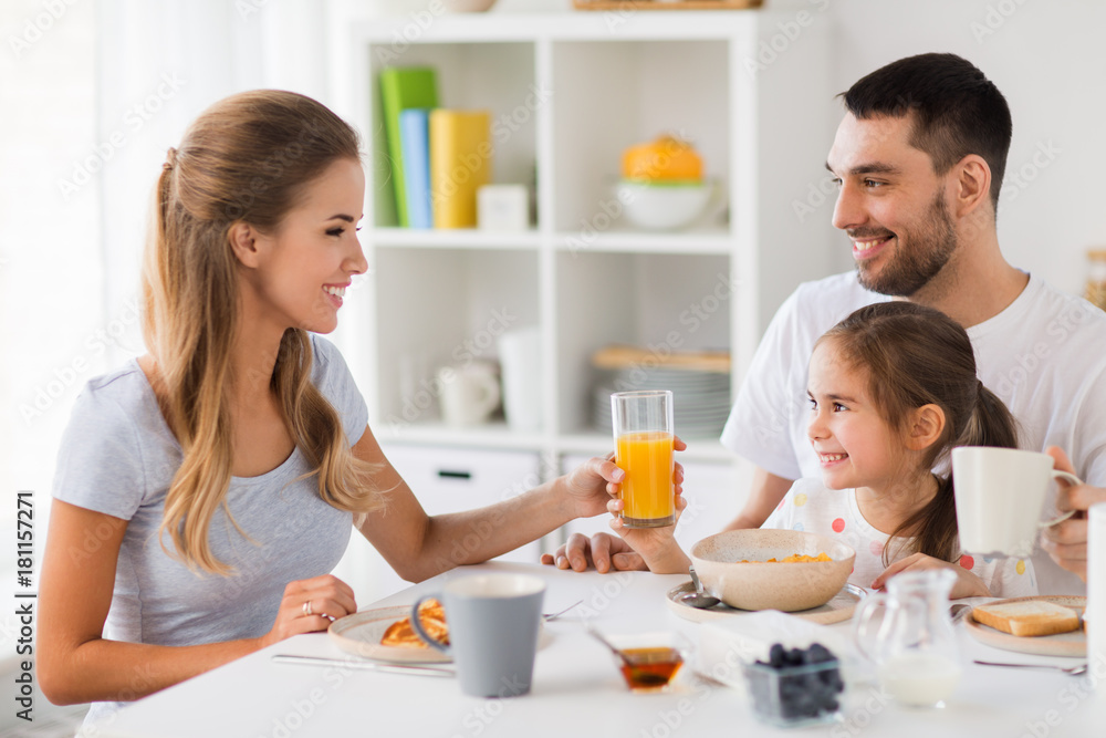 happy family having breakfast at home