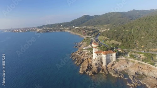 Calafuria coastal line and road in Tuscany, aerial view. photo