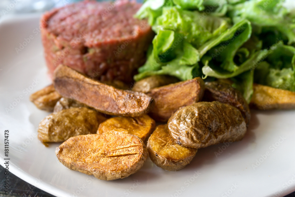 tasty Steak tartare (Raw beef) - classic steak tartare on white plate