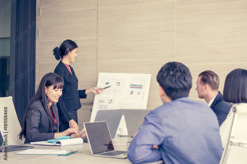 Asian Business Woman presenting her work with team at the meeting room, People working Concept. Asian Business Woman presenting her work with team at the meeting room, People working Concept.