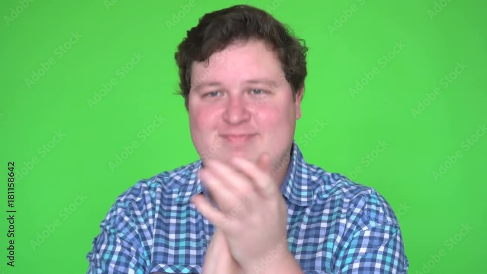 Young man clapping on chroma key green screen background Young man clapping on chroma key green screen background