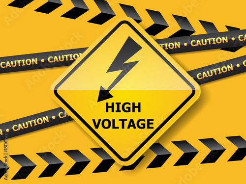 high voltage sign on yellow wall