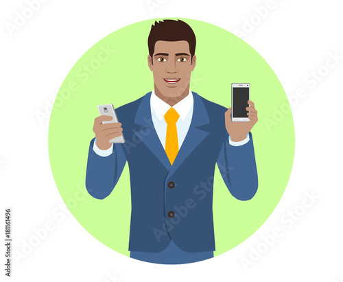 Businessman with two mobile phones