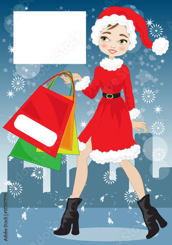 Smiling woman in red dress with christmas gifts