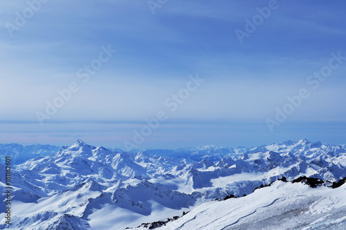 beautiful winter mountains with blue sky, snowy peaks. amazing scenic nature landscape.