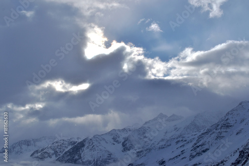 beautiful view of clouds crossing the mountain ridge. awesome mountain