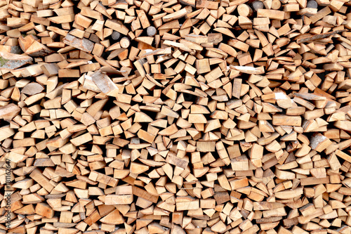 woodpile with firewood. photo on the theme of wood texture background, material design