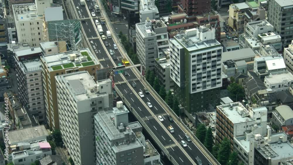 Busy Tokyo city road cars in traffic jam from aerial above view Busy Tokyo city road cars in traffic jam from aerial above view