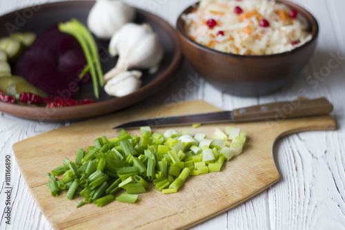 Traditional Russian pickled cucumbers, onions, beets, chili, garlic, sauerkraut with cranberries on the table