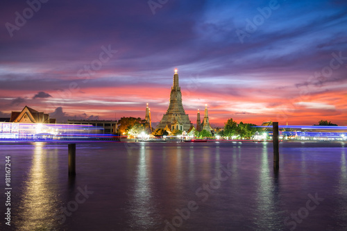 Wat Arun Temple during sunset with dramatic sky in Bangkok, Thailand