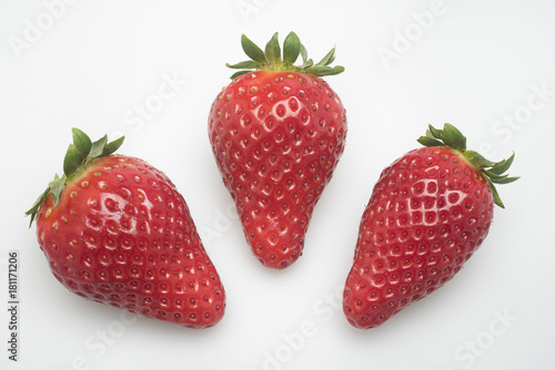 three strawberry on white background
