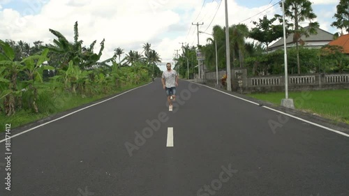 Wallpaper Mural Man running on the road in exotic place, steadycam shot, slow motion shot at 240fps
 Torontodigital.ca
