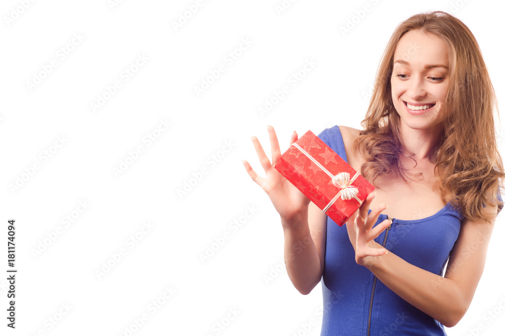 Young beautiful woman in hands holding a holiday gift Young beautiful woman in hands holding a holiday gift
