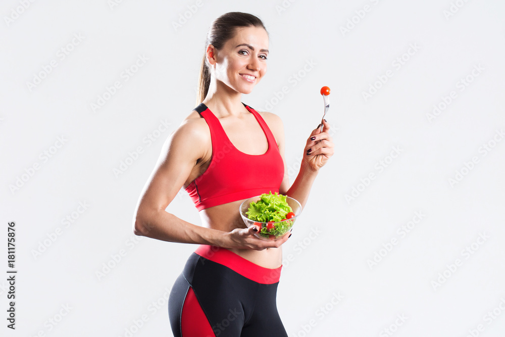 Happy sports woman with salad Isolated. Happy sports woman with salad Isolated.