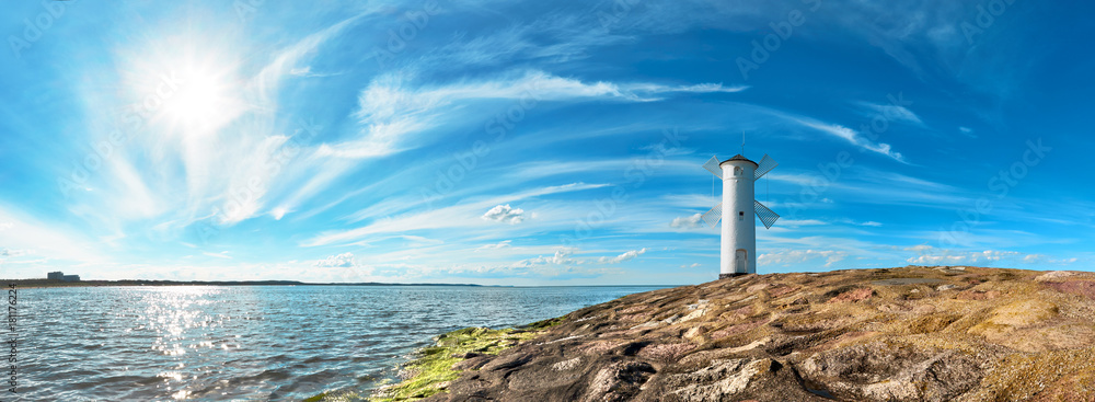 Panoramic image of a seaside by lighthouse in Swinoujscie, Poland - obrazy, fototapety, plakaty 