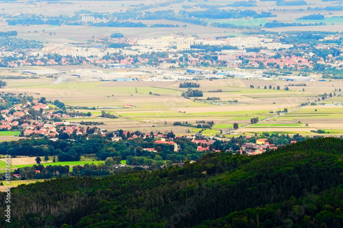 Scenic valley with vast panorama landscape of Dzierzoniow and Pieszyce towns in Lower Silesia Province in Poland. Aerial view from the Great Owl summit in The Owl Mountains, Sudetes.