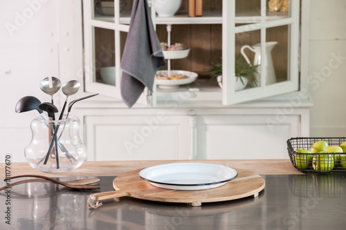 white kitchen cupboard kitchen ornaments and empty white plate on the table          © UnitedPhotoStudio