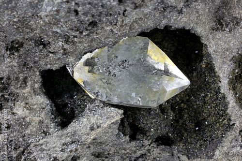 Herkimer diamond nestled in bedrock isolated on white background photo