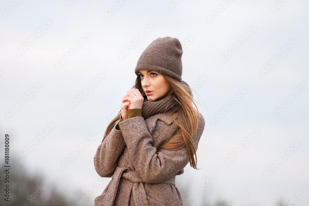 girl in a knitted cap and scarf in the autumn on nature. cold. girl in a knitted cap and scarf in the autumn on nature. cold.
