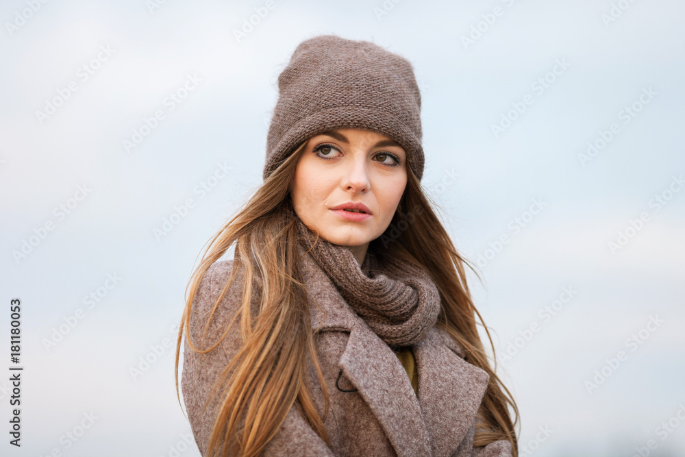 girl in a knitted cap and scarf in the autumn on nature. cold. girl in a knitted cap and scarf in the autumn on nature. cold.