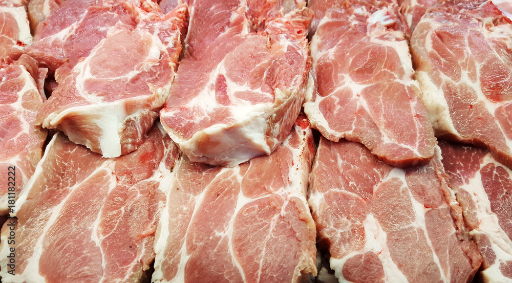 Pieces of raw pork meat  for sale in the market