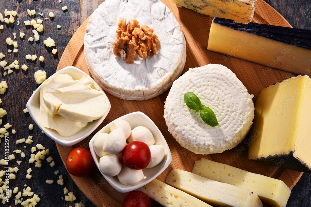 Different sorts of cheese on kitchen table Different sorts of cheese on kitchen table