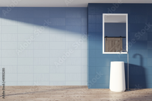 Blue bathroom interior, sink and mirror © ImageFlow