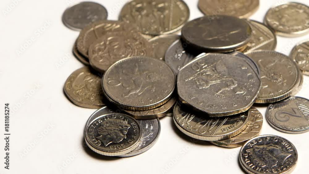 Silver coins of different countries on the table Silver coins of different countries on the table