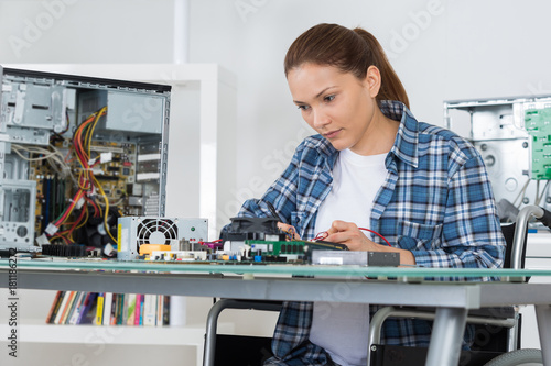 Wallpaper Mural female pc technician fixing computer Torontodigital.ca